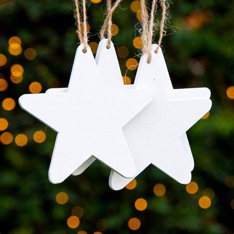 Set Of Four White Wooden Hanging Star Decorations By Flourishy