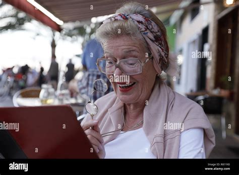 Attractive 78 Year Old Woman During A Summer Restaurant Visit