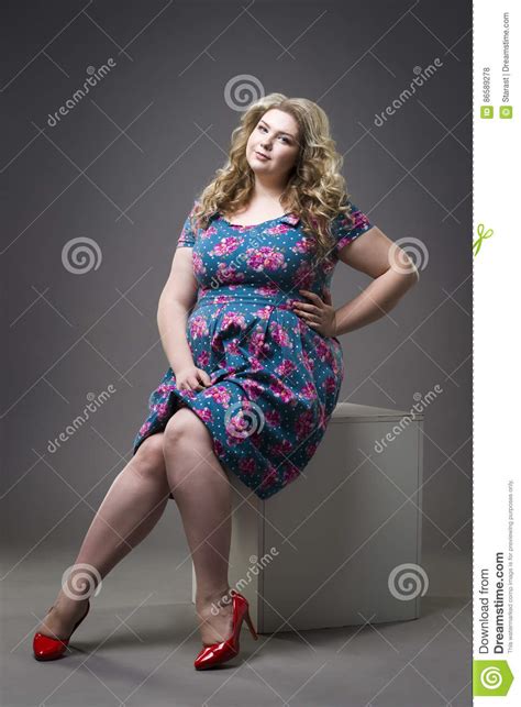 Young Beautiful Happy Blonde Plus Size Model In Dress And