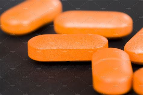 A Long Orange Pill Health And Medical Stock Photos Creative Market