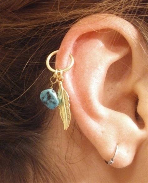 A standard helix piercing is made in the outer upper cartilage, but you can also get forward, double or triple helix piercings. Turquoise Gold Cartilage Hoop Feather Earring Boho Tragus ...