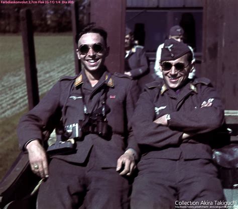 World War Ii In Color Two Luftwaffe Soldiers Wearing Black Glasses