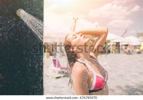 Beautiful Sexy Woman Taking A Shower On The Beach