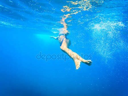 Naked Woman Free Diver Glides Over Sandy Sea With Fins Freedivi