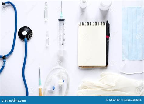 Various Medical Equipment And Notepad On White Background Stock Image