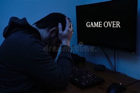 Gamer Wearing Headphones Sad Because He Has Lost The Video Game Game