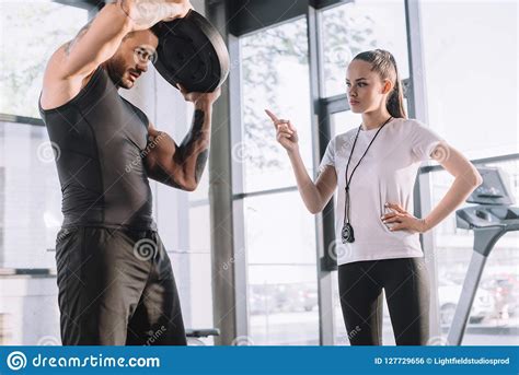 Female Personal Trainer Counting While Sportsman Stock Photo Image Of