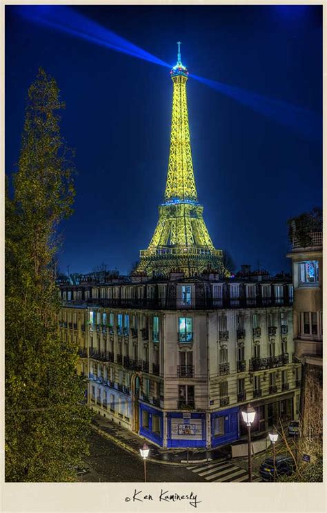 Illuminated Eiffel Tower At Night In Paris France