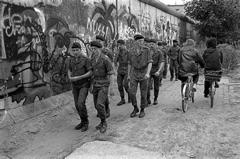 French Soldiers Patrolling The Berlin Wall Jogging Along And Singing