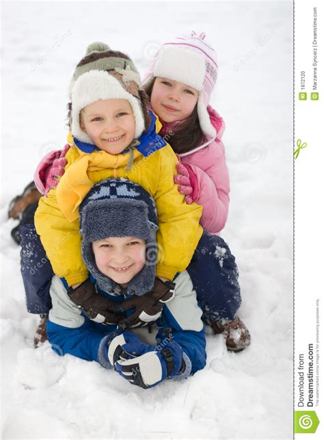 Happy Kids Playing In Fresh Snow Stock Photo Image Of