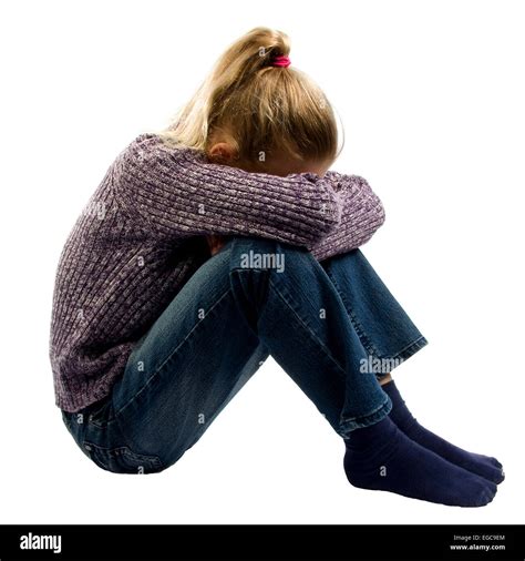 Sad Girl Sitting On Ground Crying Over White Background Stock Photo Alamy