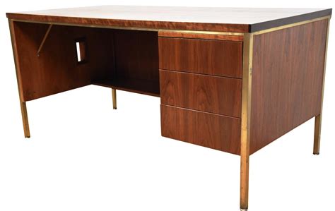 A Mid Century Modern Walnut Executive Desk With A Brass Frame This