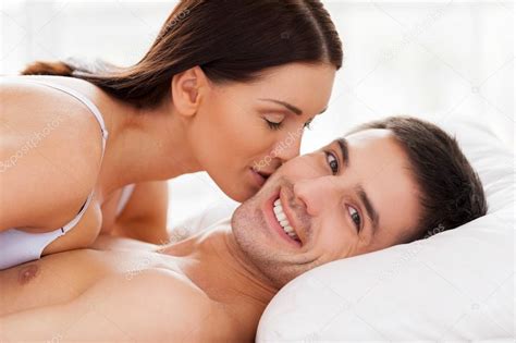 1068 x 1700 jpeg 182 кб. Couple lying in bed while woman kissing her boyfriend at ...
