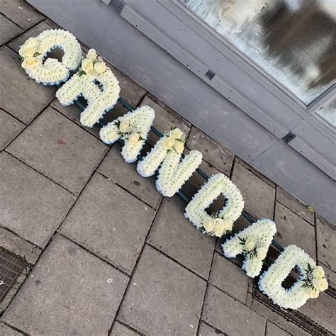 Where our designs include a sundry item like a vase or basket it. White and blue grandad funeral flowers tribute wreath ...