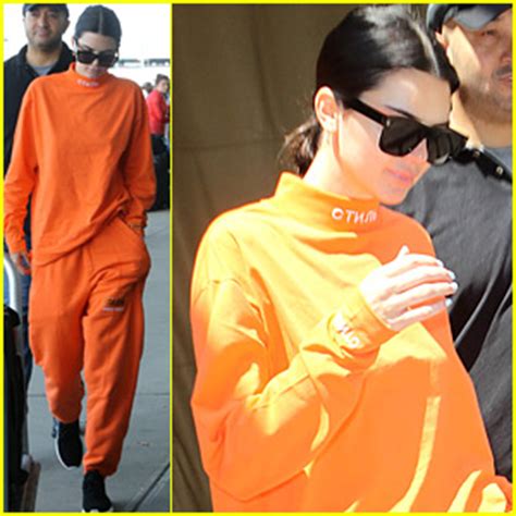 Kendall Jenner Wears All Orange For Her Flight Out Of New York