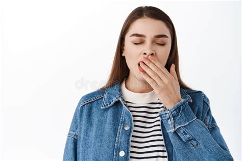 Close Up Of Tired Teenage Girl Yawning Close Eyes And Cover Mouth While Yawn Sleepy Feeling