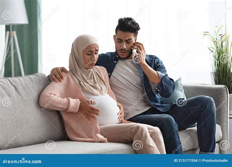 Pregnant Muslim Woman Suffering Labor Pain At Home Her Husband Calling