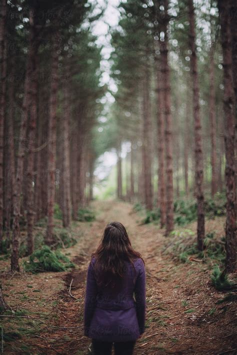 Back Of A Girl Standing On A Path In The Forest Del Colaborador De Stocksy Paff Stocksy