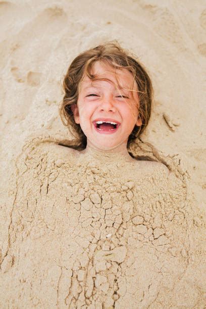 340 Child Buried Sand Stock Photos Pictures And Royalty Free Images