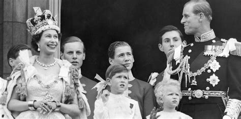 Queen elizabeth ii, wearing the imperial crown, smiles and waves to a crowd from balcony of buckingham palace on june 3, 1953, in london, on returning from westminster abbey following her coronation. 50 facts about The Queen's Coronation | The Royal Family