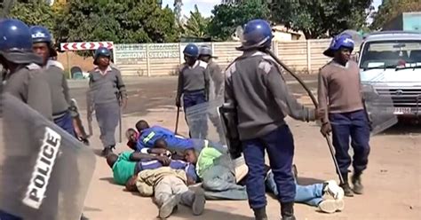 Riot Police Lash Out At Striking Taxi Drivers