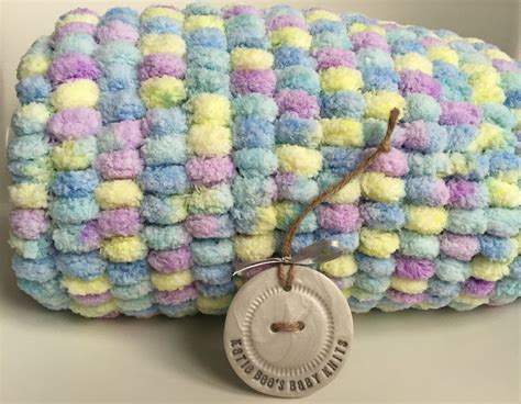 Thankfully, making a pom pom is not hard. Pom pom baby blanket Hand knitted Blue Yellow Purple ...
