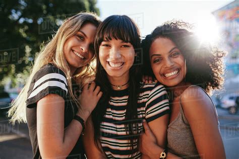 Three Beautiful Smiling Young Women Friends Standing Together Multi