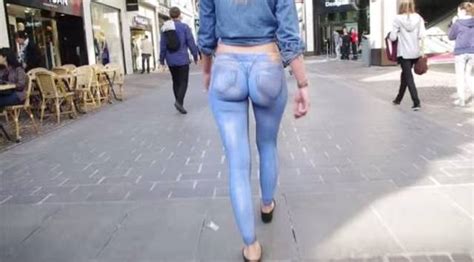 Girl Wearing Just A Thong And Body Painted Jeans Walks Down Busy Street