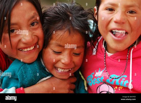 Ecuador Latacunga Close Up Portrait Of Three Girl Friends Laughing And Smiling Embracing And