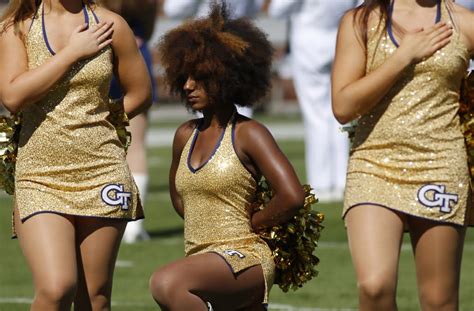 Photo Of Cheerleader Kneeling During National Anthem Goes Viral