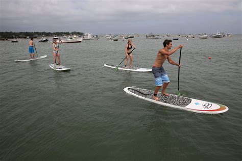 stand up paddleboarding now one of the fastest growing water sports the boston globe