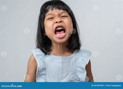 Portrait Of Angry Emotional Asian Girl Screaming And Frustrated