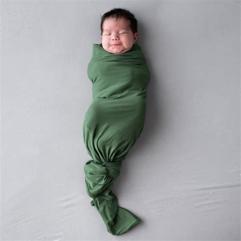 What Are The Benefits Of Swaddling A Baby