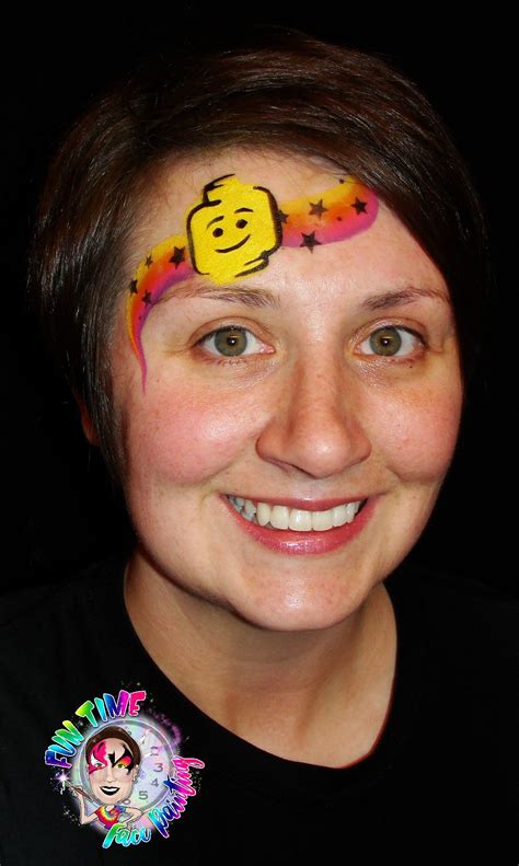 A Woman With Her Face Painted Like A Smiley Face