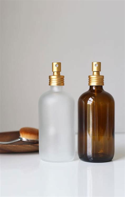 This Small Glass Misting Bottle With A Golden Aluminum Spray Nozzle Is