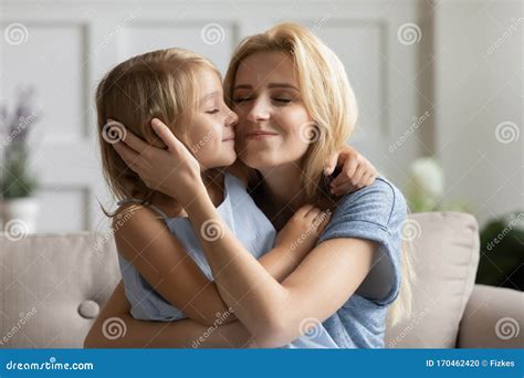 Affectionate Young Mother Embracing Small Daughter Stock Photo Image