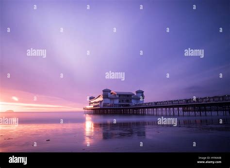 Grand Pier At Weston Super Mare Reflected In Wet Sand And Sea At Sunset Stock Photo Alamy