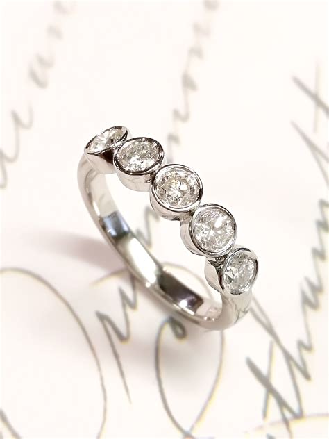 Platinum Bespoke Ring With 5 Diamonds In Rub Over Settings The