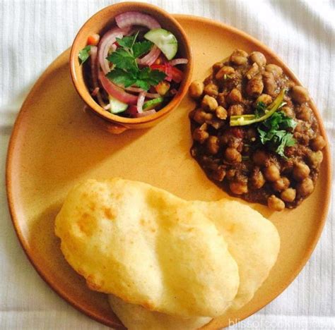 Chole bhature is a combination of spicy chickpea curry and fried. Chole Bhature - Bliss Of Cooking