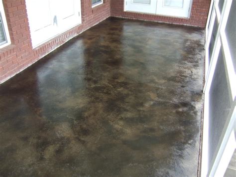Acid etches or eats away any white milky stains that are left on the newly exposed aggregate concrete. Southern Concrete Designs LLC - Photo Gallery 2