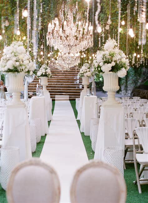 A Beautiful White And Green Ceremony Setting For A Romantic Sparkling