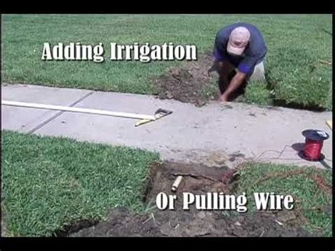 How to run conduit under driveway with tight space? Sidewalk Sleever - YouTube | Underground sprinkler ...