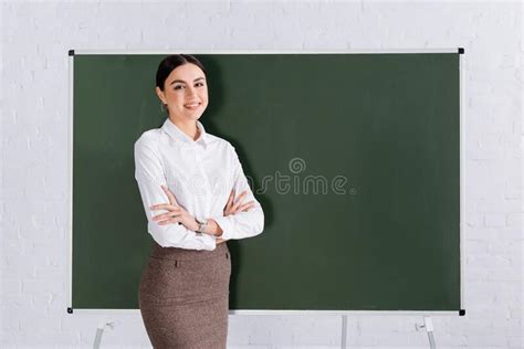 Teacher With Crossed Arms Looking At Stock Image Image Of Workplace