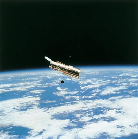 Satellite In Orbit Above Earth Photograph By Stockbyte