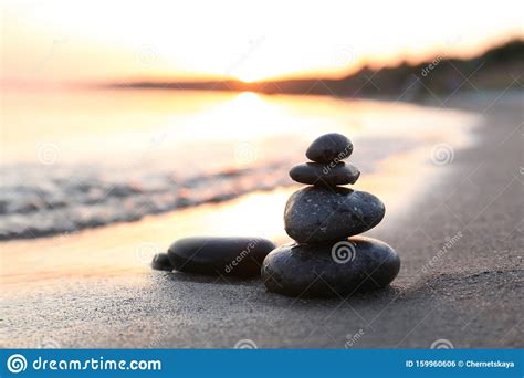 Dark Stones On Sand Near Sea At Sunset Zen Concept Stock Photo Image