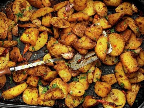 Spiced Roast Potatoes With Chilli Peppers Stock Photo Dissolve