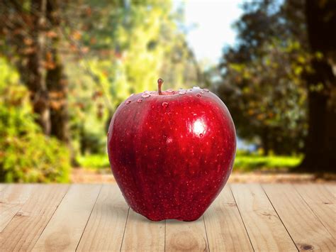 Red Apple Placed On Table · Free Stock Photo