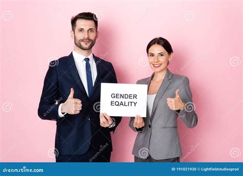 Handsome Businessman And Businesswoman Holding Placard With Gender
