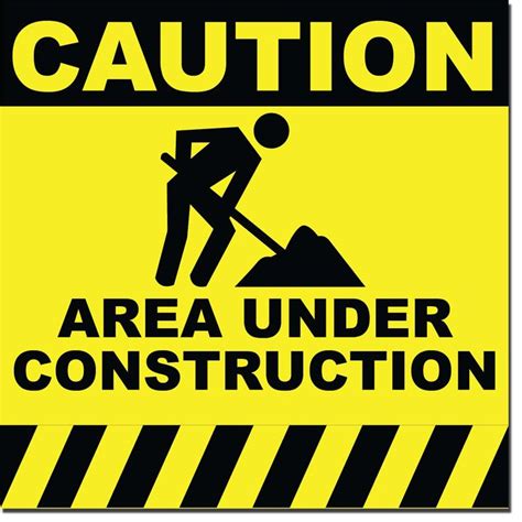 A Caution Sign That Says Area Under Construction With An Image Of A Man