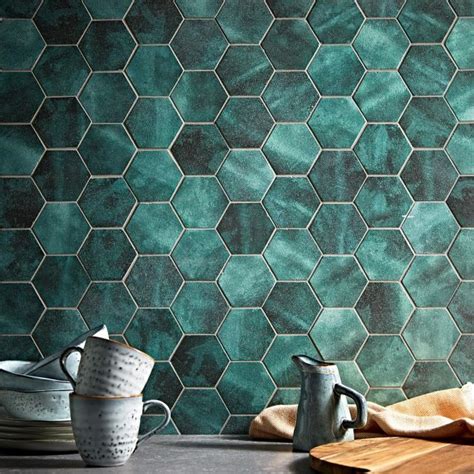 Small black hex tiles with brass grout and a matching faucet to create an elegant and refined look in the sink zone. Nebula Black Hexagon | Green color trends, Green hexagon ...